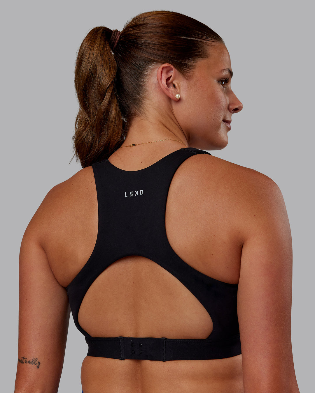 Woman wearing Ascent Sports Bra - Black | Model:Phoebe | Size:S