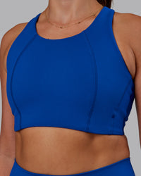 Woman wearing Ascent Sports Bra - Blue Quartz | Model:Phoebe | Size:S