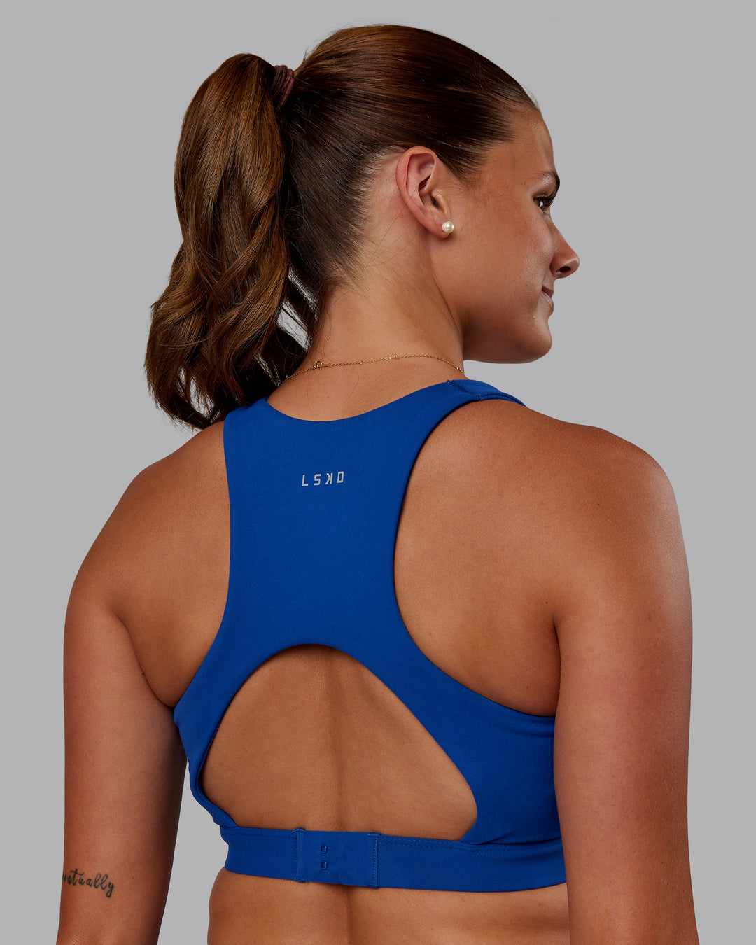 Woman wearing Ascent Sports Bra - Blue Quartz | Model:Phoebe | Size:S