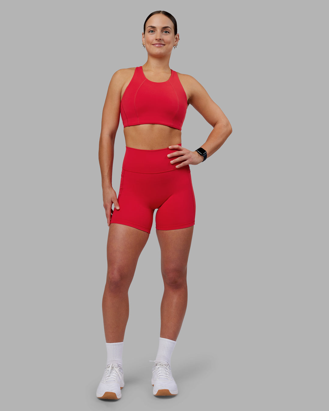 Woman wearing Ascent Sports Bra - Scarlet | Model:Keisha | Size:S