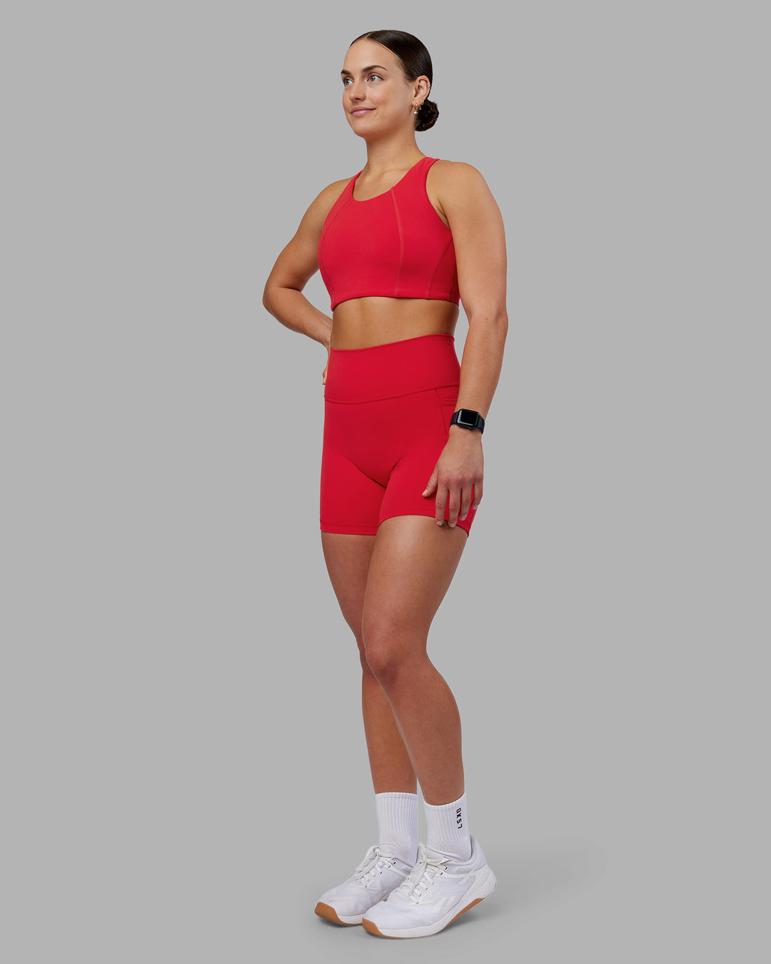 Woman wearing Ascent Sports Bra - Scarlet | Model:Keisha | Size:S