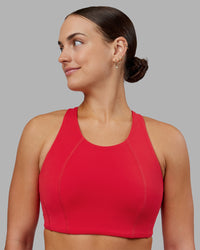 Woman wearing Ascent Sports Bra - Scarlet | Model:Keisha | Size:S