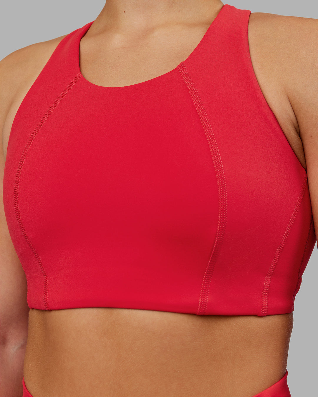 Woman wearing Ascent Sports Bra - Scarlet | Model:Keisha | Size:S