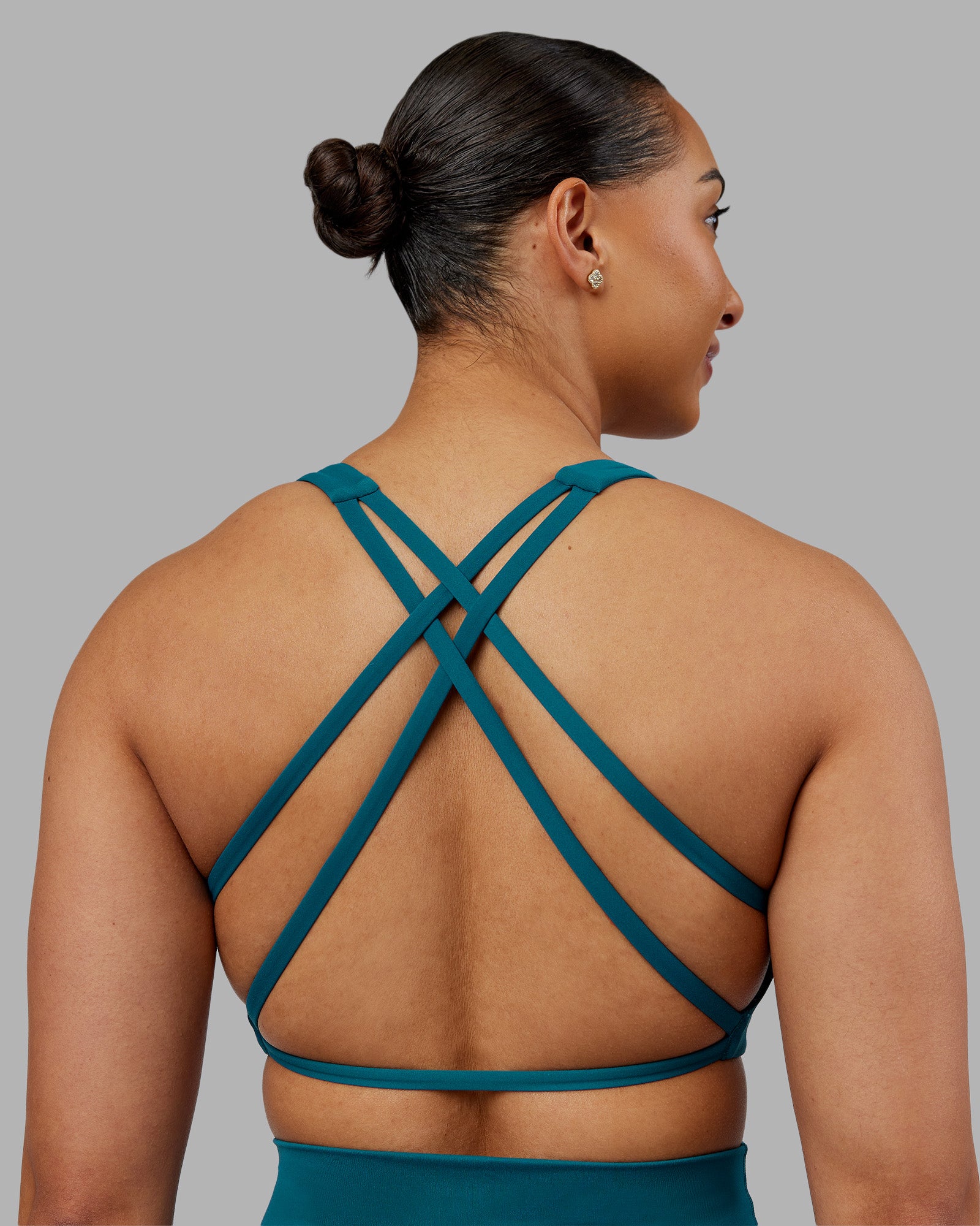 Woman wearing Aspire Sports Bra - Blue Coral | Model:Ayla | Size:S