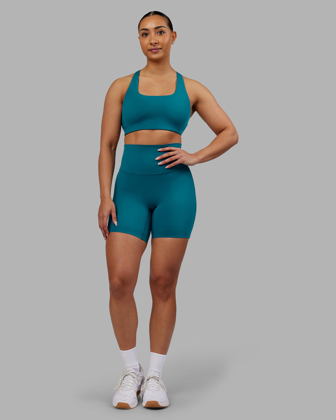 Woman wearing Aspire Sports Bra - Blue Coral | Model:Ayla | Size:S