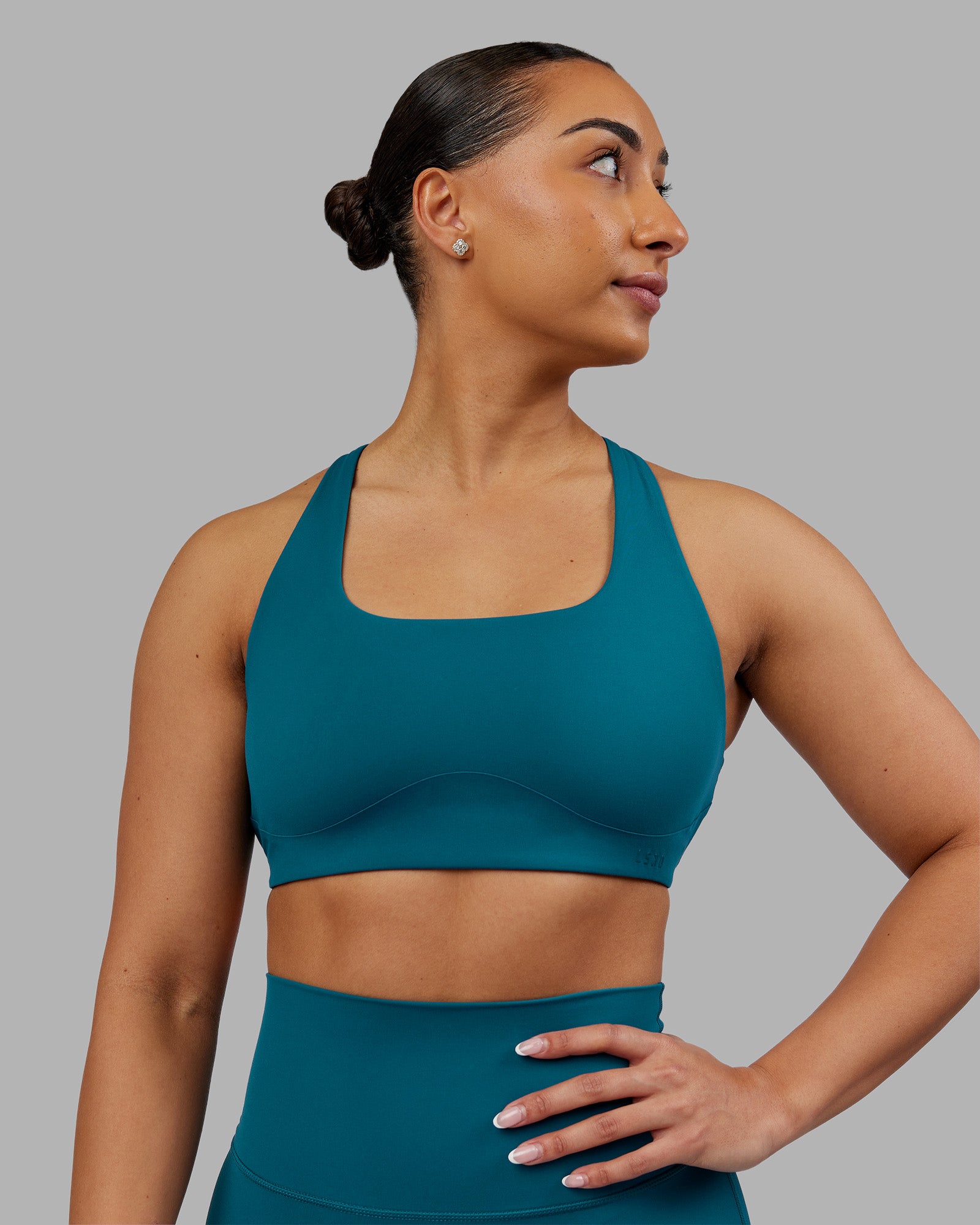 Woman wearing Aspire Sports Bra - Blue Coral | Model:Ayla | Size:S