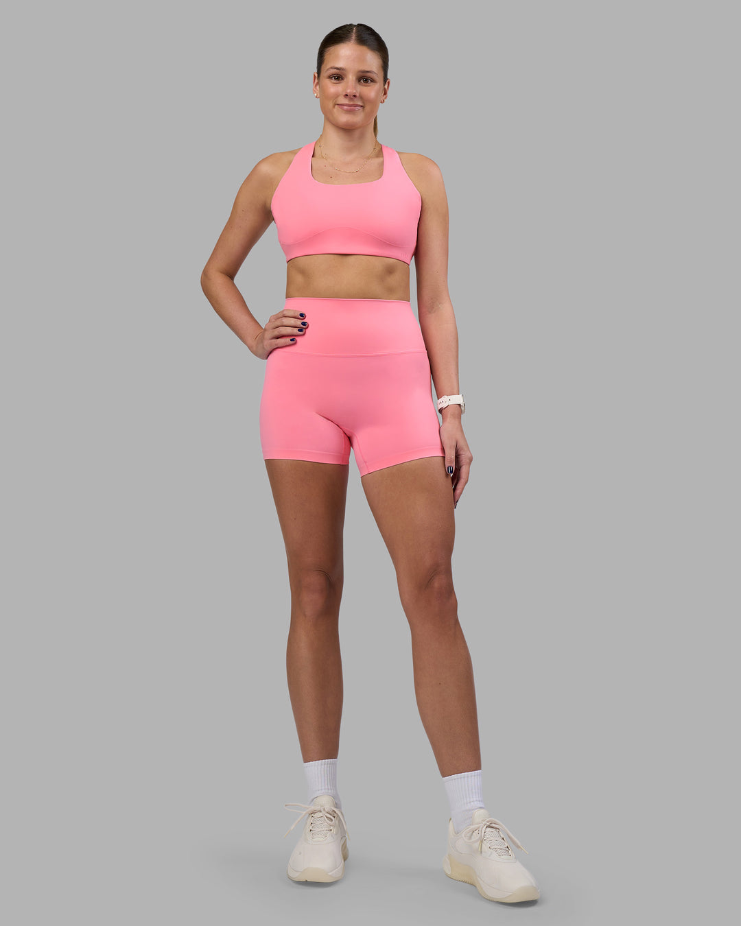 Woman wearing Aspire Sports Bra - Candy Pink | Model:Phoebe | Size:S