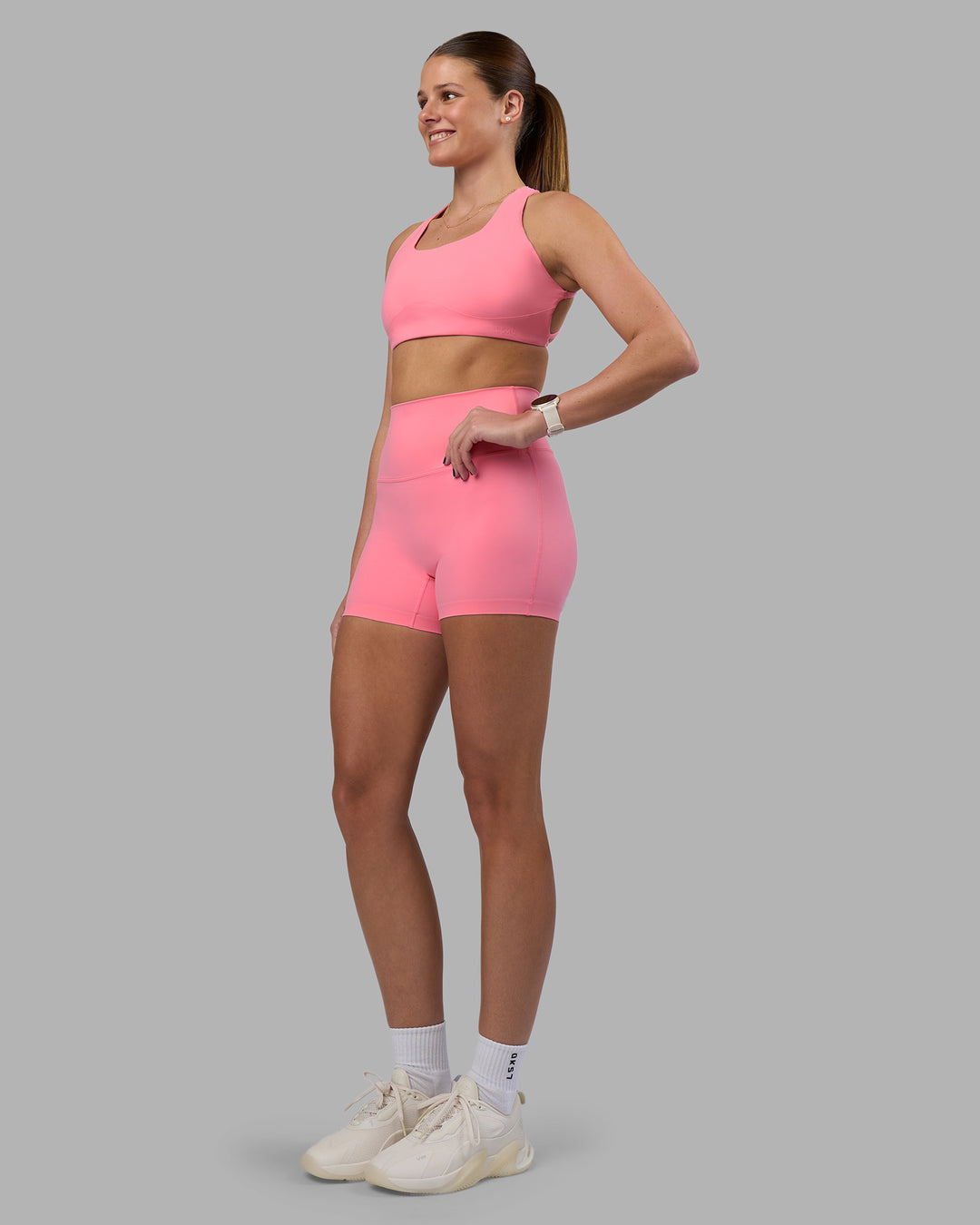 Woman wearing Aspire Sports Bra - Candy Pink | Model:Phoebe | Size:S
