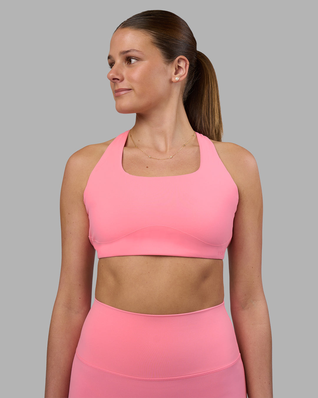 Woman wearing Aspire Sports Bra - Candy Pink | Model:Phoebe | Size:S