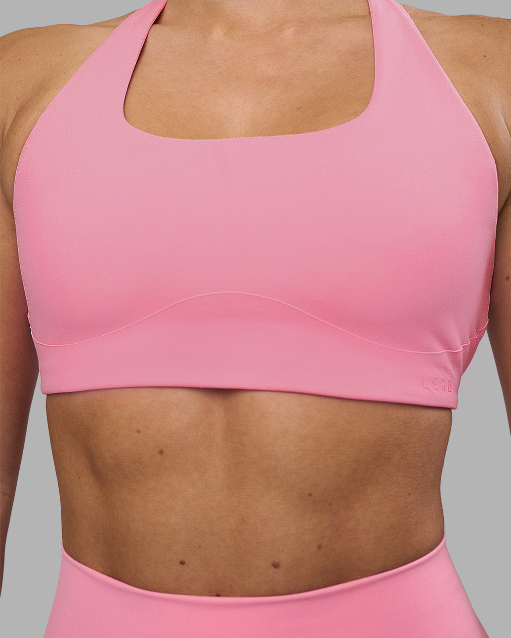 Woman wearing Aspire Sports Bra - Candy Pink | Model:Hannah | Size:S