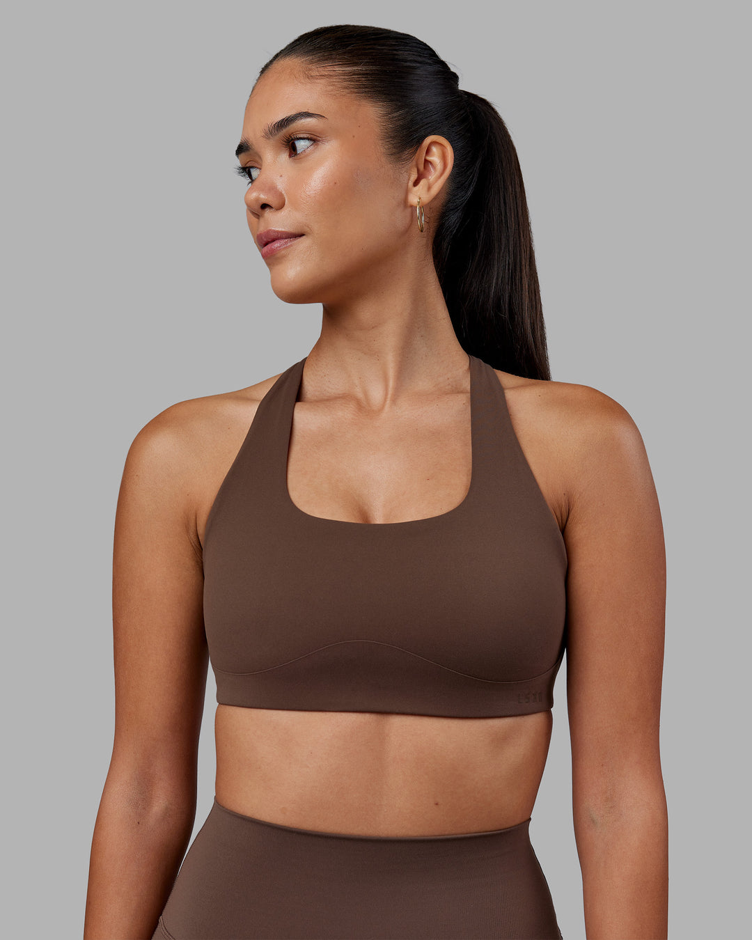 Woman wearing Aspire Sports Bra - Chocolate Martini | Model:Rhiley | Size:S