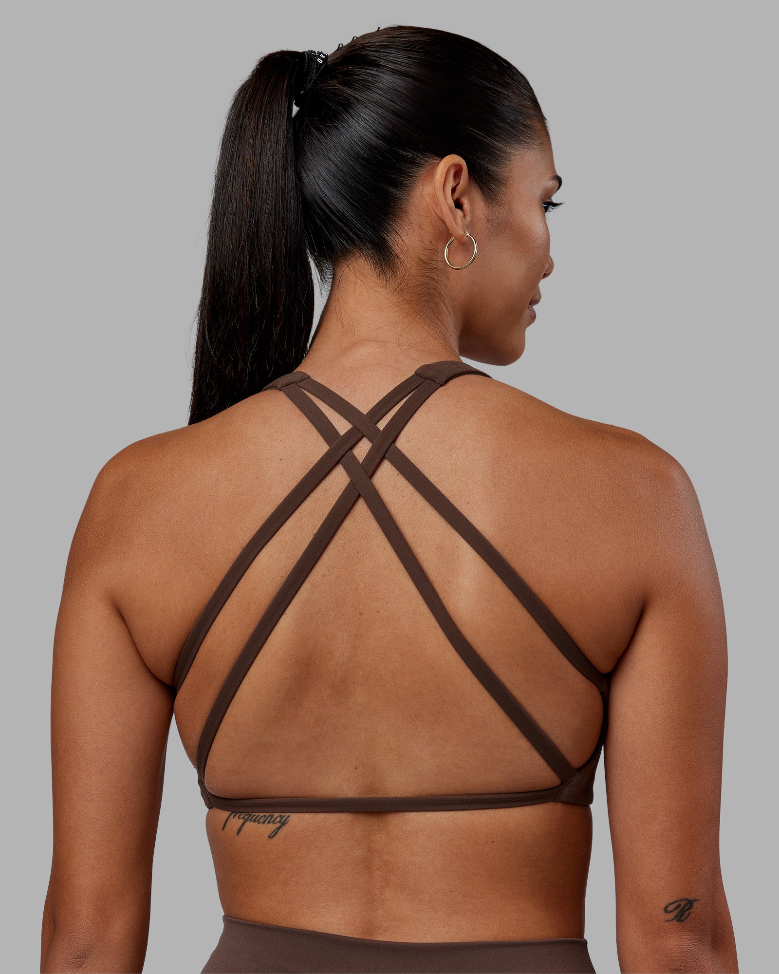 Woman wearing Aspire Sports Bra - Chocolate Martini | Model:Rhiley | Size:S