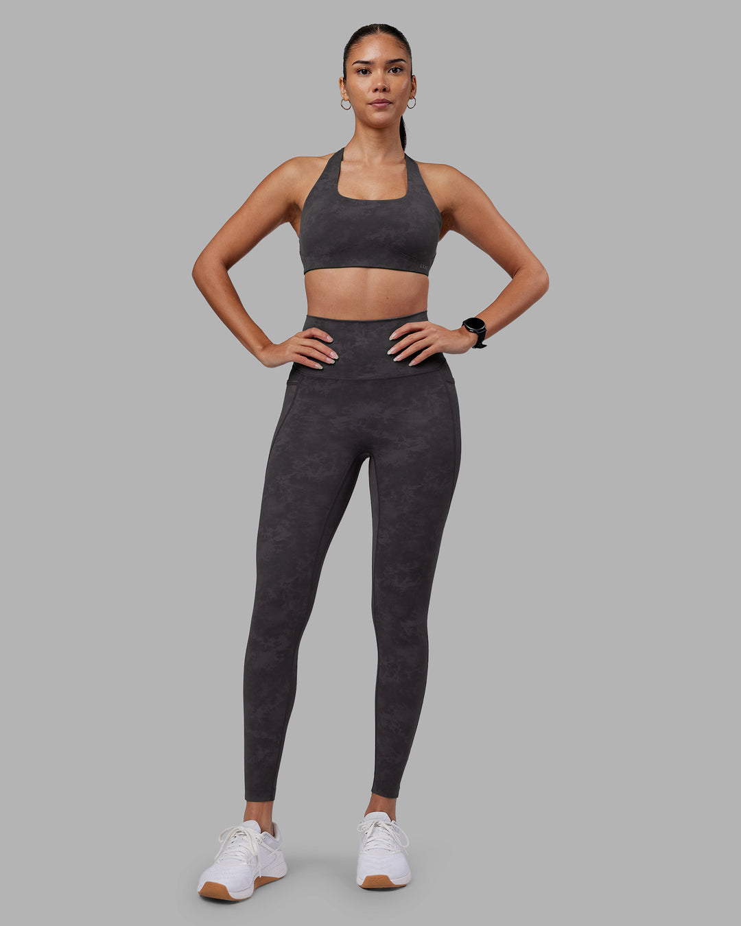 Woman wearing Aspire Sports Bra - Dark Storm Wash | Model:Rhiley | Size:S