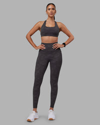 Woman wearing Aspire Sports Bra - Dark Storm Wash | Model:Rhiley | Size:S
