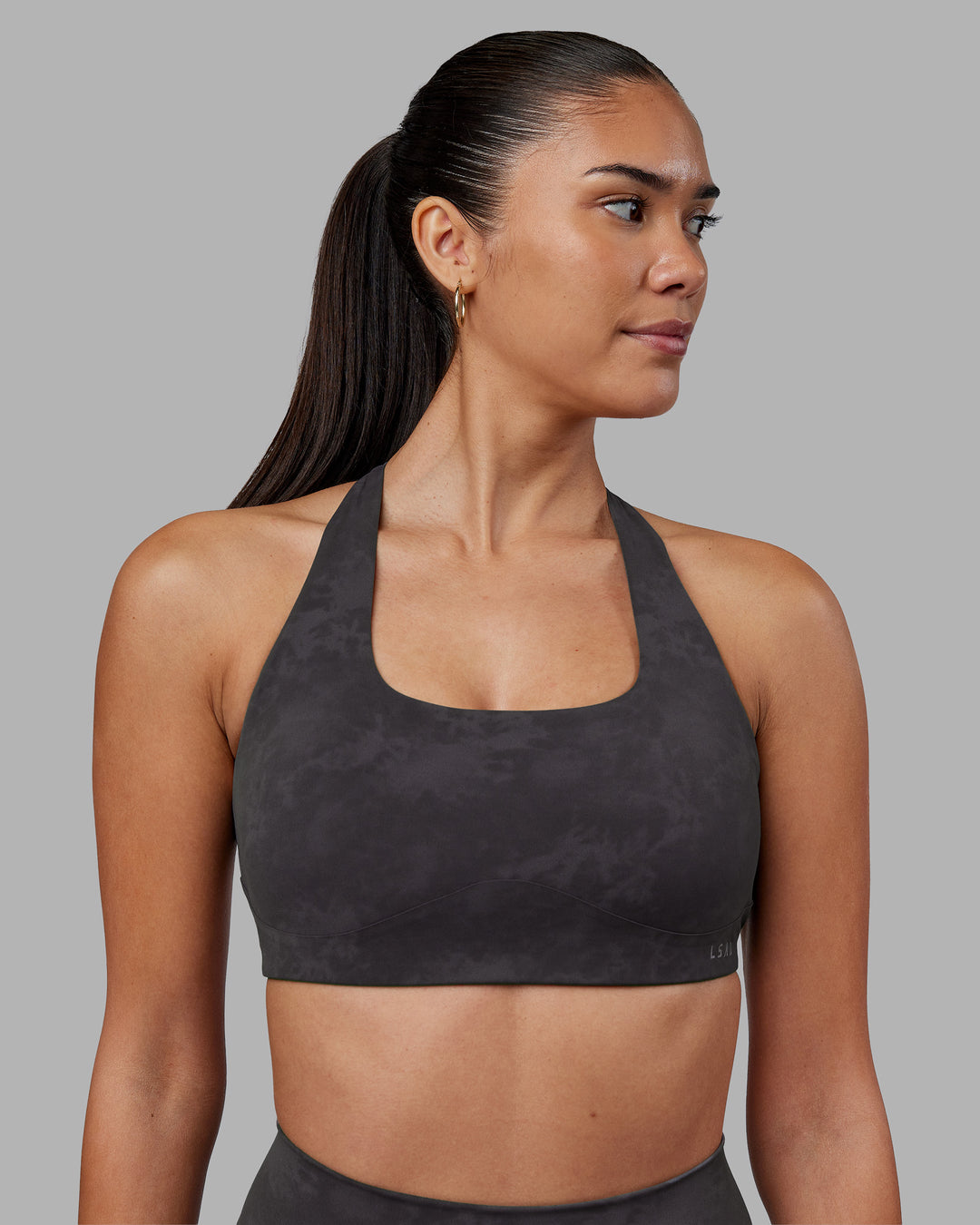 Woman wearing Aspire Sports Bra - Dark Storm Wash | Model:Rhiley | Size:S