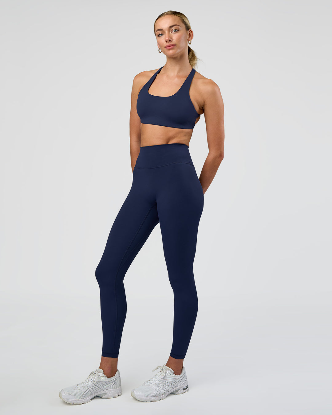 Woman wearing Aspire Sports Bra - Future Navy | Model:Evie | Size:S