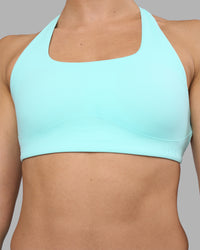 Woman wearing Aspire Sports Bra - Island Paradise | Model:Sophie | Size:S
