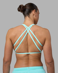 Woman wearing Aspire Sports Bra - Island Paradise | Model:Sophie | Size:S