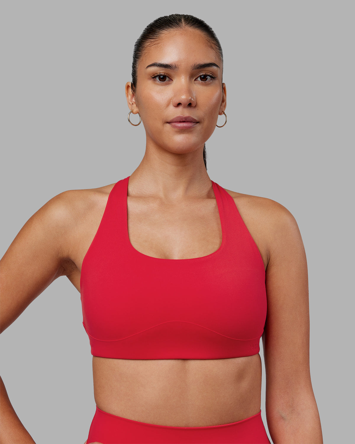 Woman wearing Aspire Sports Bra - Scarlet | Model:Rhiley | Size:S