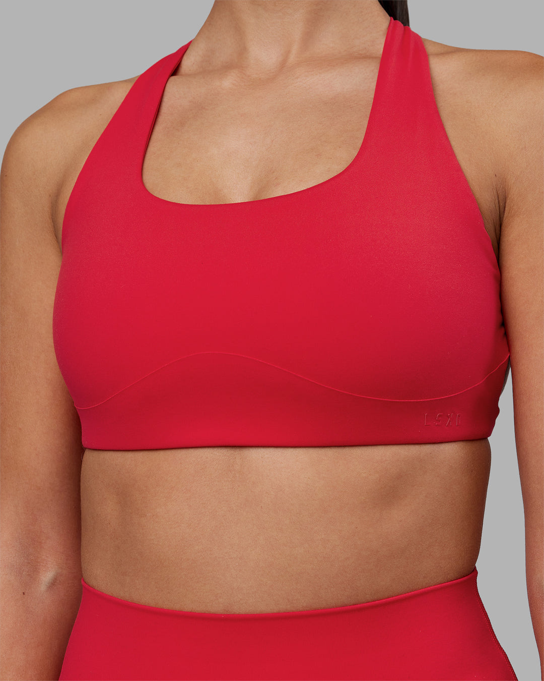 Woman wearing Aspire Sports Bra - Scarlet | Model:Rhiley | Size:S