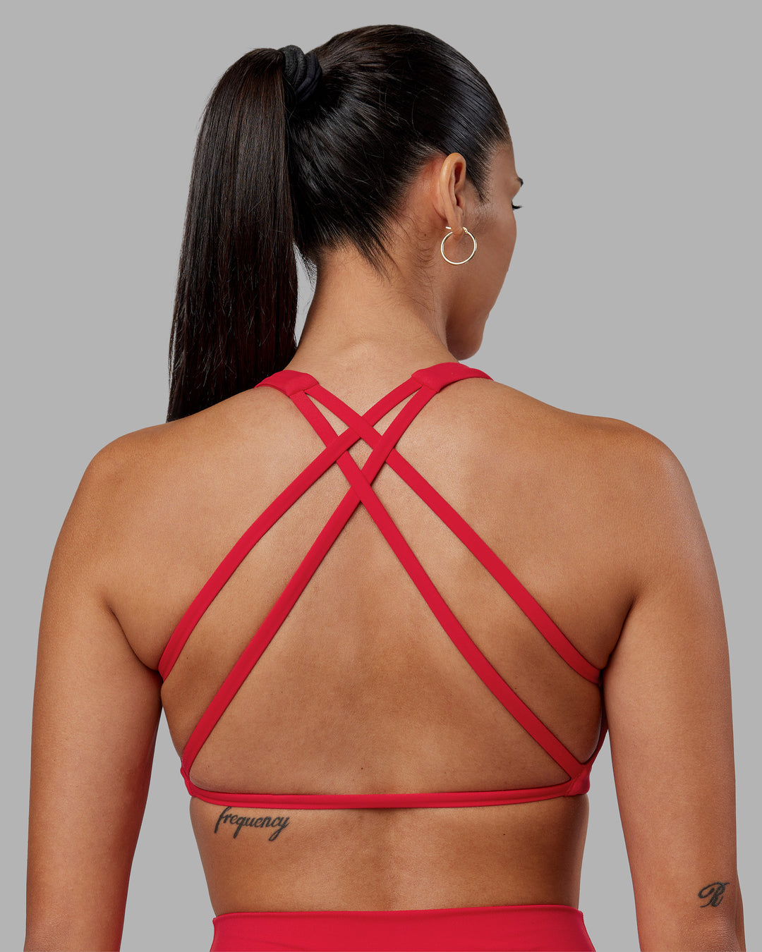 Woman wearing Aspire Sports Bra - Scarlet | Model:Rhiley | Size:S