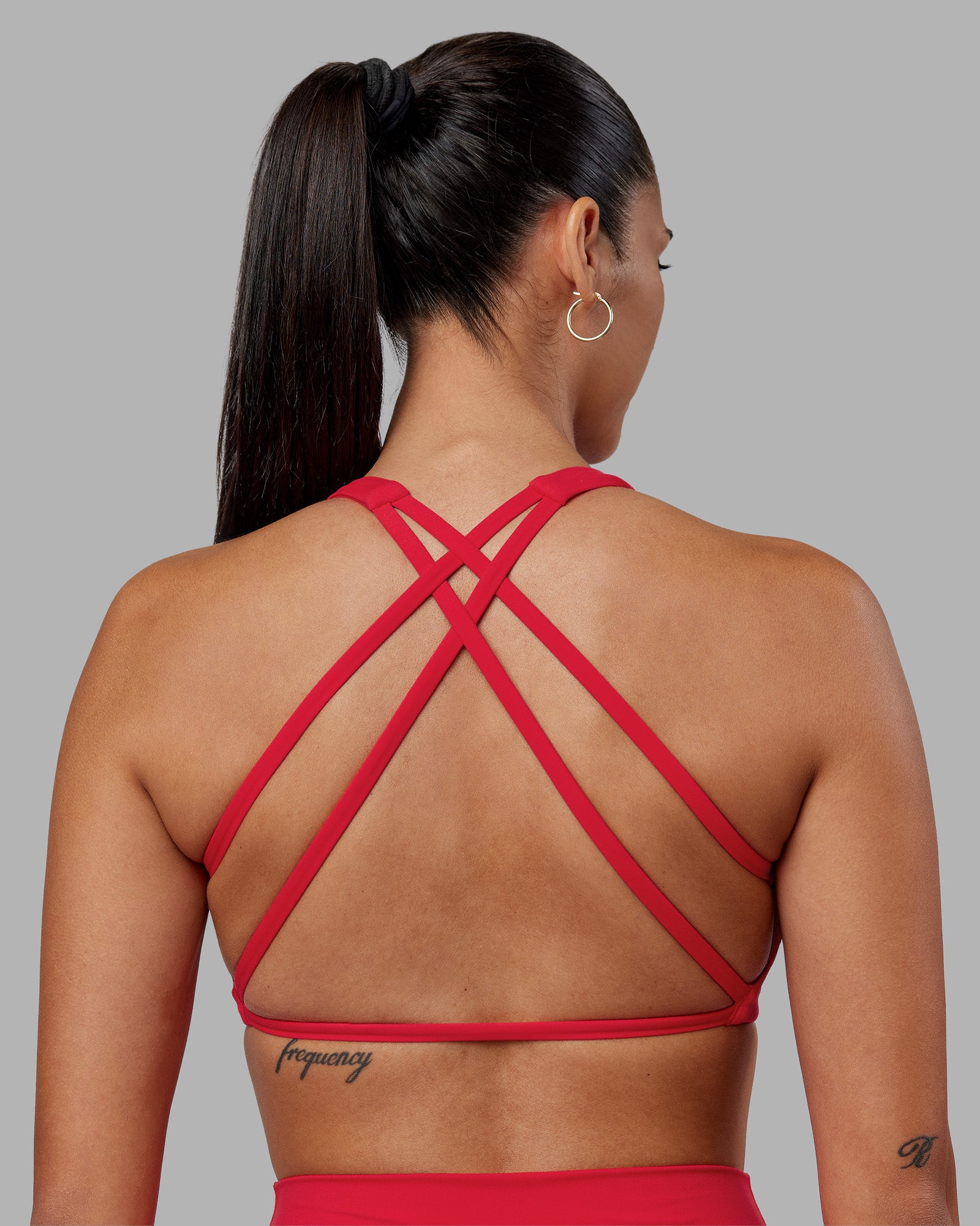 Woman wearing Aspire Sports Bra - Scarlet | Model:Rhiley | Size:S