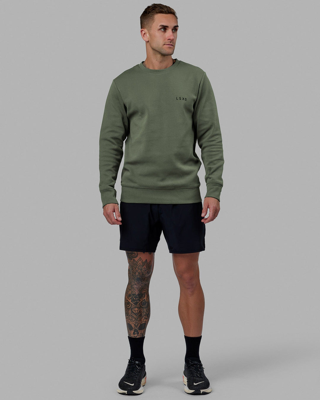 Man wearing Athlete ForgedFleece Sweater - Dark Forest