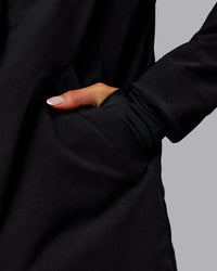 Woman wearing Auxiliary 2.0 Jacket - Black | Model:Ella | Size:S