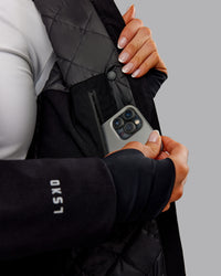 Woman wearing Auxiliary 2.0 Jacket - Black | Model:Ella | Size:S