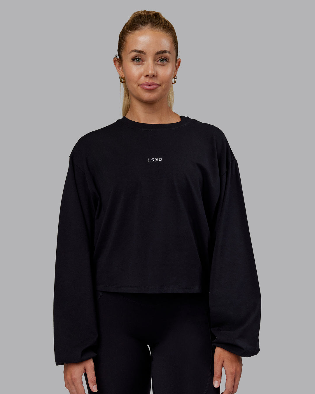 Woman wearing Go-To Balloon Sleeve FLXCotton Tee - Black | Model:Hannah | Size:S