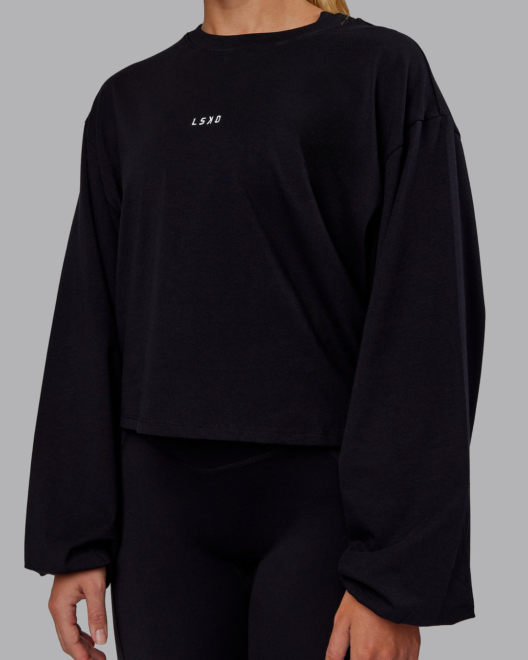 Woman wearing Go-To Balloon Sleeve FLXCotton Tee - Black | Model:Hannah | Size:S