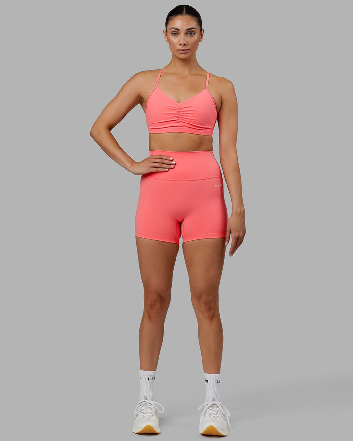 Woman wearing Base 2.0 X-Short Tights - Coral