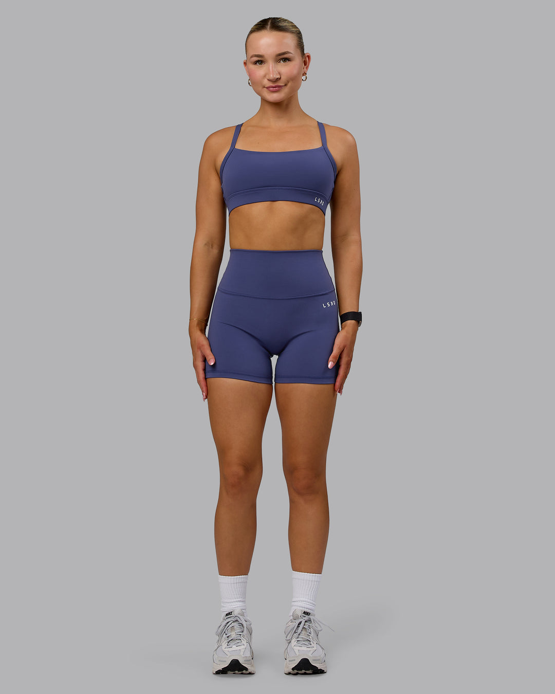 Woman wearing Base 2.0 Ultra High-Rise 4&quot; Short - Future Dusk