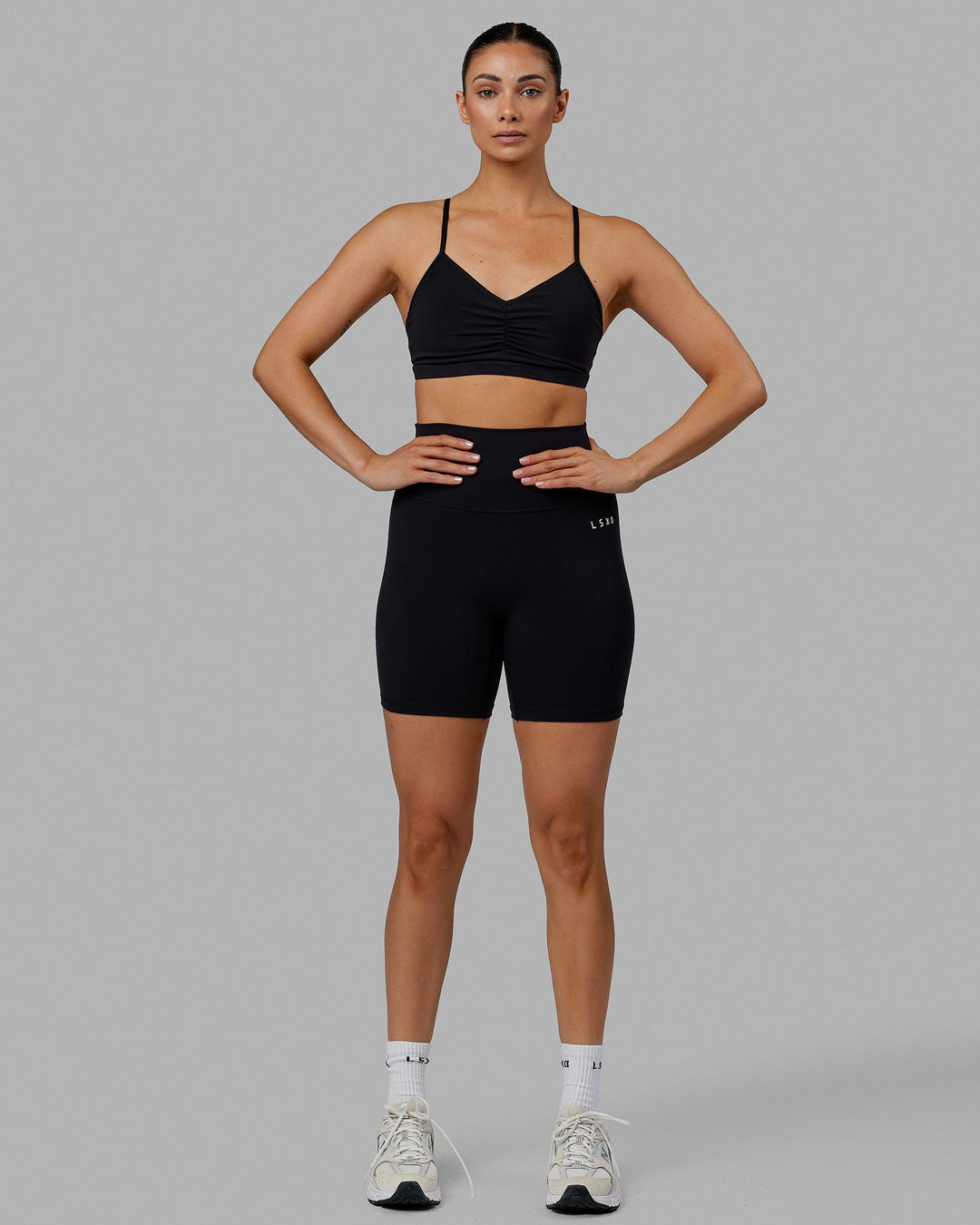 Woman wearing Base 2.0 Mid Short Tights - Black