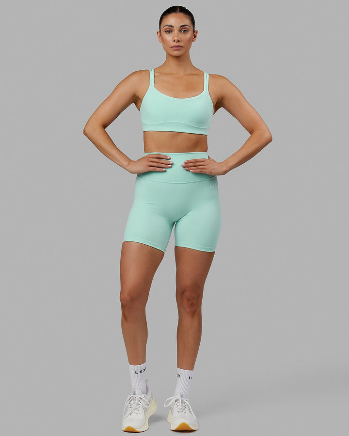 Woman wearing Base 2.0 Mid Short Tights - Pastel Turquoise
