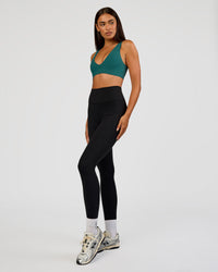 Woman wearing Bend & FLX Plunge Sports Bra - Transformative Teal | Model:Ruby | Size:S