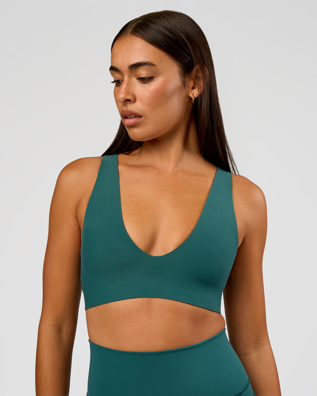 Woman wearing Bend &amp; FLX Plunge Sports Bra - Transformative Teal | Model:Ruby | Size:S