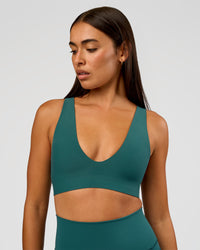 Woman wearing Bend & FLX Plunge Sports Bra - Transformative Teal | Model:Ruby | Size:S