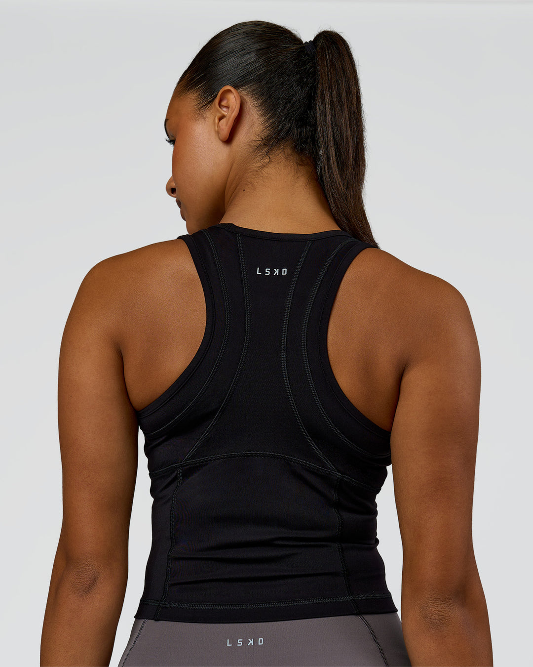 Woman wearing Bend Performance Tank - Black | Model:Rosie | Size:S
