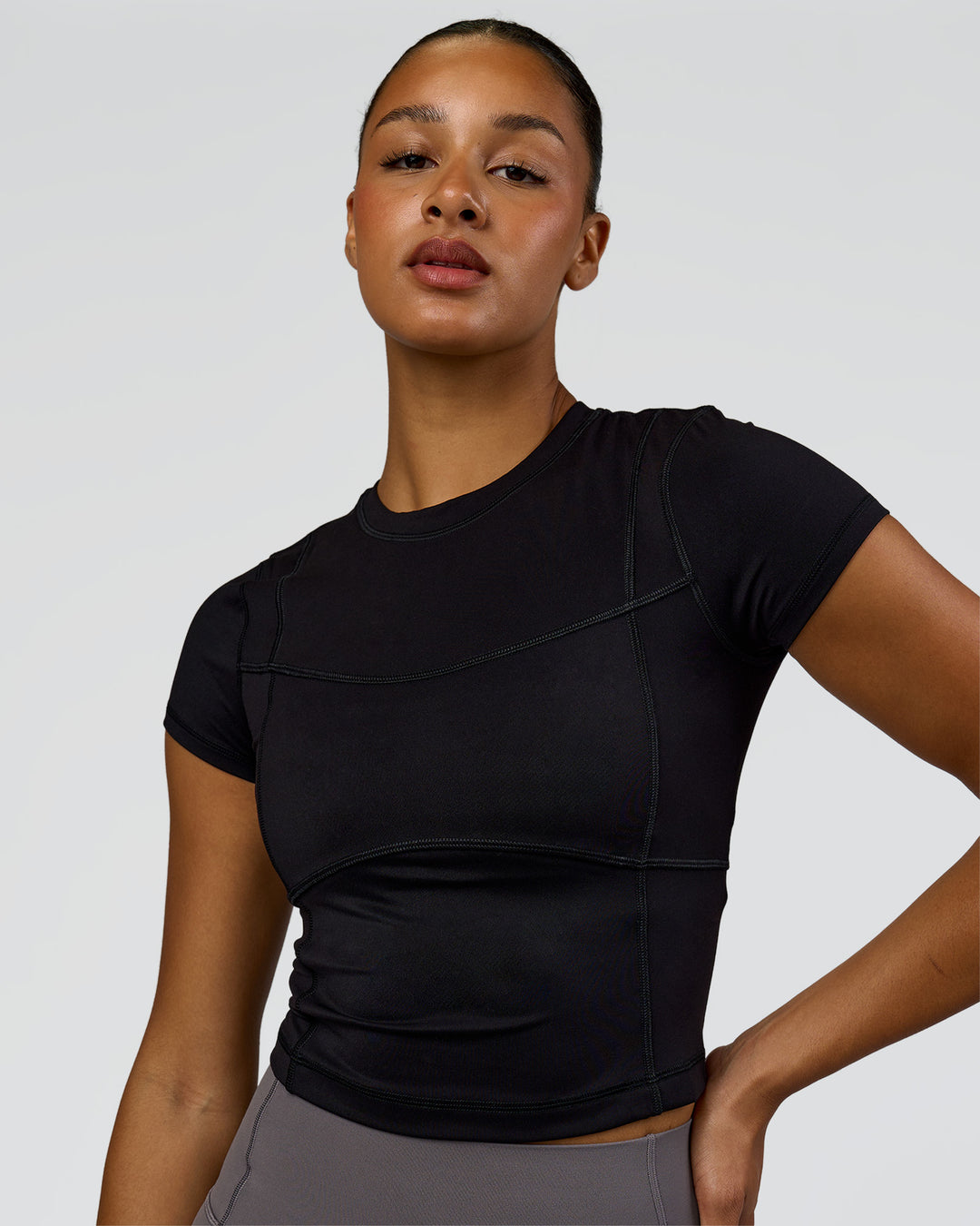 Woman wearing Bend Performance Tee - Black | Model:Rosie | Size:S