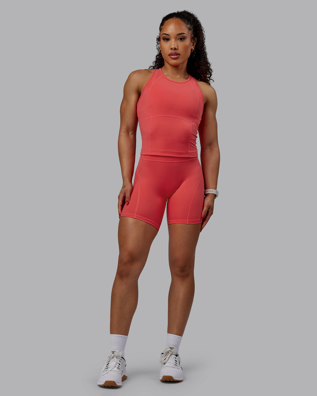 Woman wearing Bend Performance Tank - Cayenne