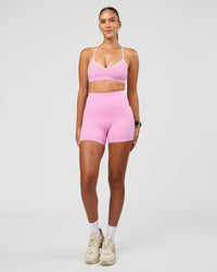 Woman wearing Blushing Sports Bra - Pink Rose-White | Model:Rhiley | Size:S