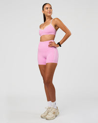 Woman wearing Blushing Sports Bra - Pink Rose-White | Model:Rhiley | Size:S