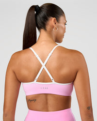 Woman wearing Blushing Sports Bra - Pink Rose-White | Model:Rhiley | Size:S