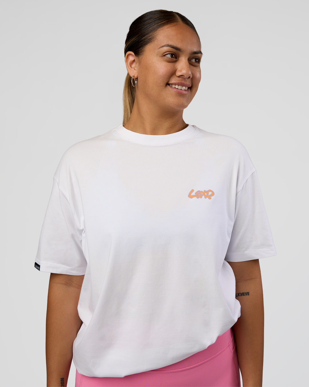 Woman wearing Break Through FLXCotton Oversized Tee - White-Pale Lilac | Model:Renee | Size:S