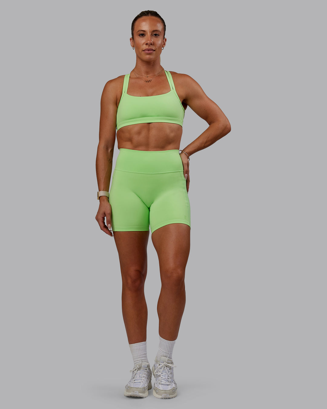 Woman wearing Bree Masters Fusion Ultra High-Rise 6&quot; Short Pockets - Pastel Lime