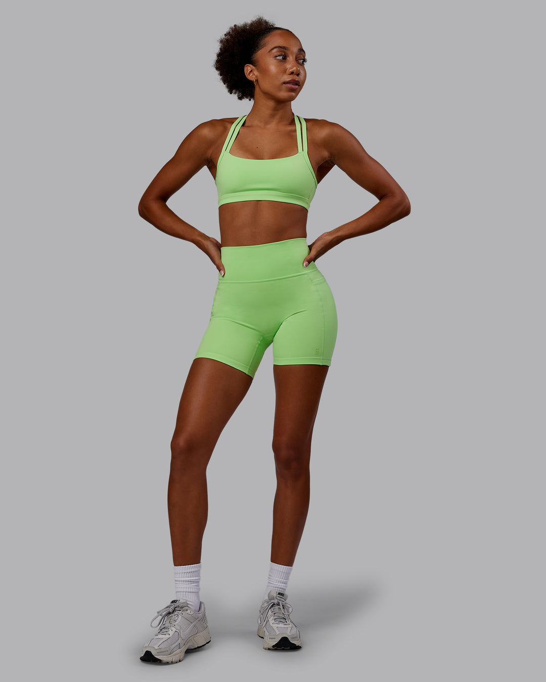 Woman wearing Bree Masters Fusion Ultra High-Rise 6&quot; Short Pockets - Pastel Lime