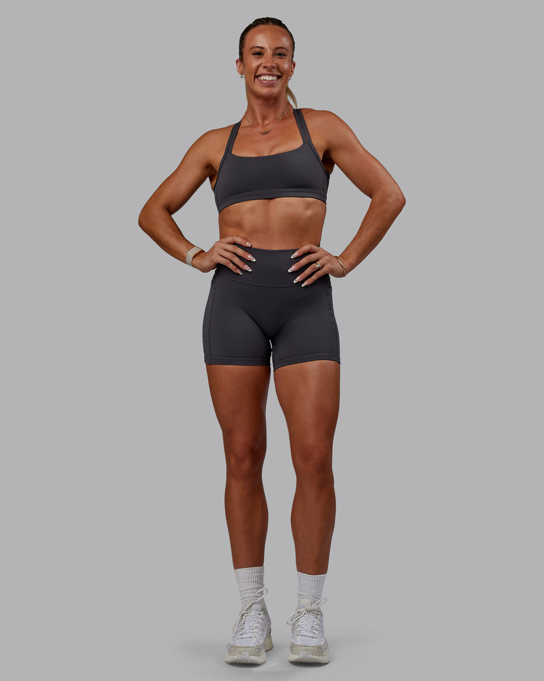 Woman wearing Bree Masters Fusion Ultra High-Rise 4&quot; Short Pockets - Stormy