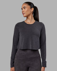 Woman wearing Breeze Long Sleeve Training Tee - Black | Model:Rhiley | Size:S