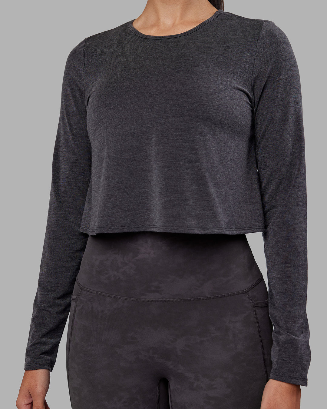 Woman wearing Breeze Long Sleeve Training Tee - Black | Model:Rhiley | Size:S